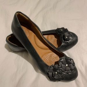 Clark’s black leather flats